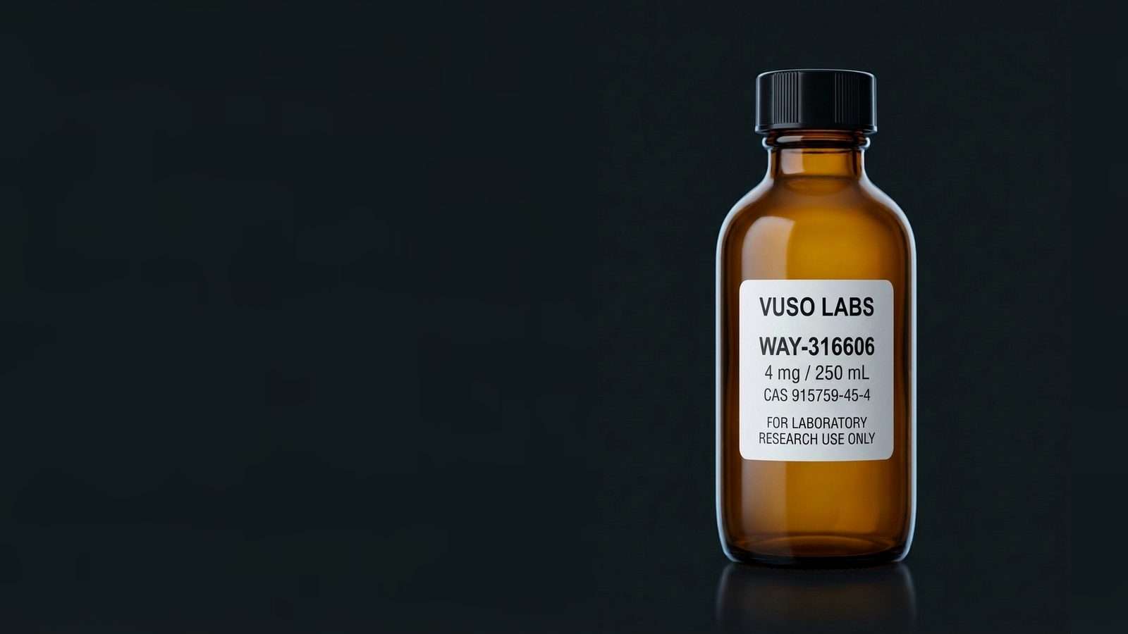 A VUSO Labs amber glass research bottle with a black screw cap and white label on a dark reflective bench, with open dark space beside it.